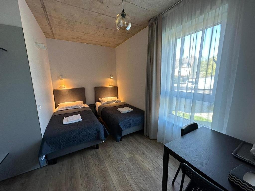 Tilžės Studio Apartments - twin bed apartment with large window, Klaipėda